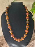 Dark wood and orange bead necklace