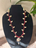 Red beads with turquoise crystal beads and shells