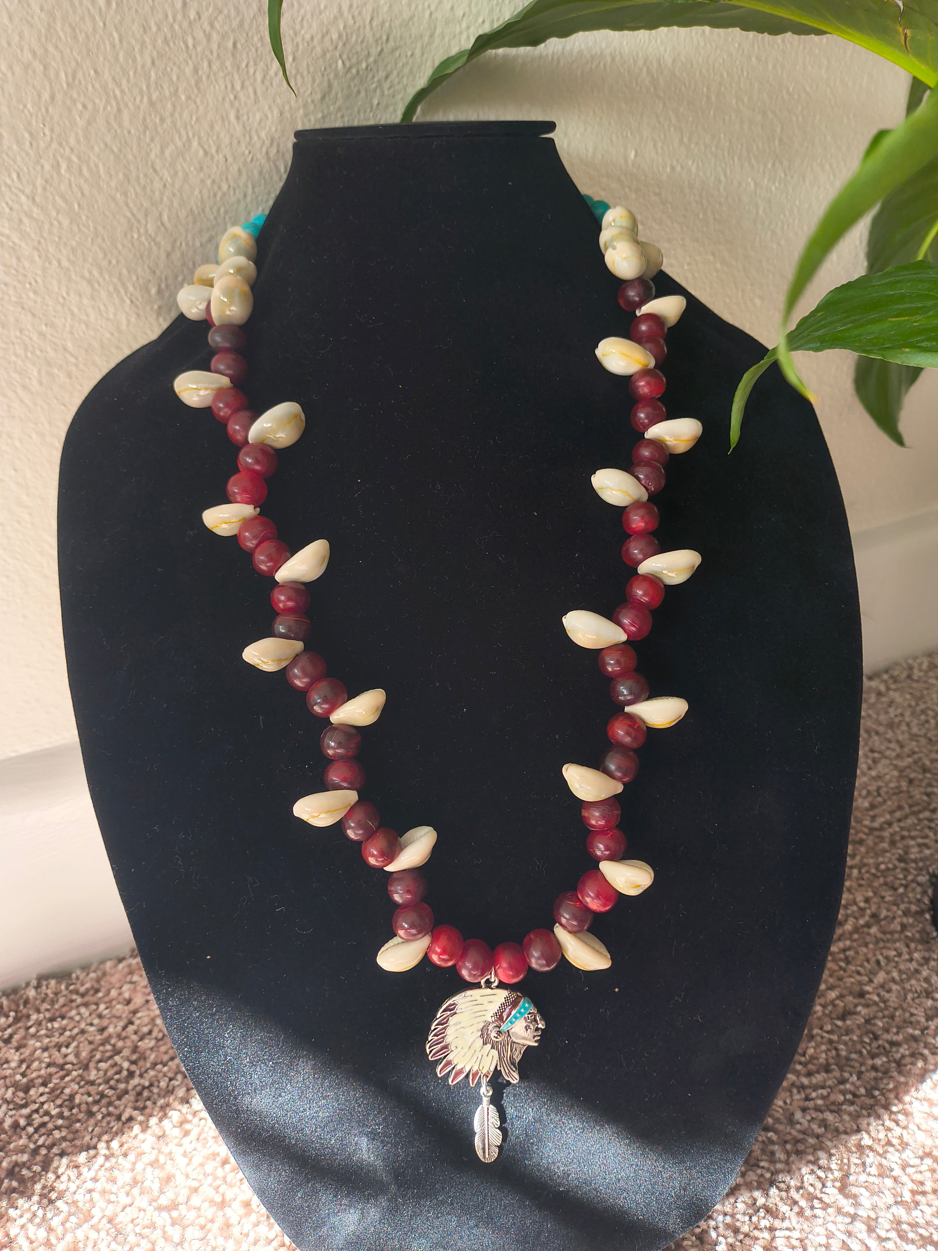 Red beads with turquoise crystal beads and shells