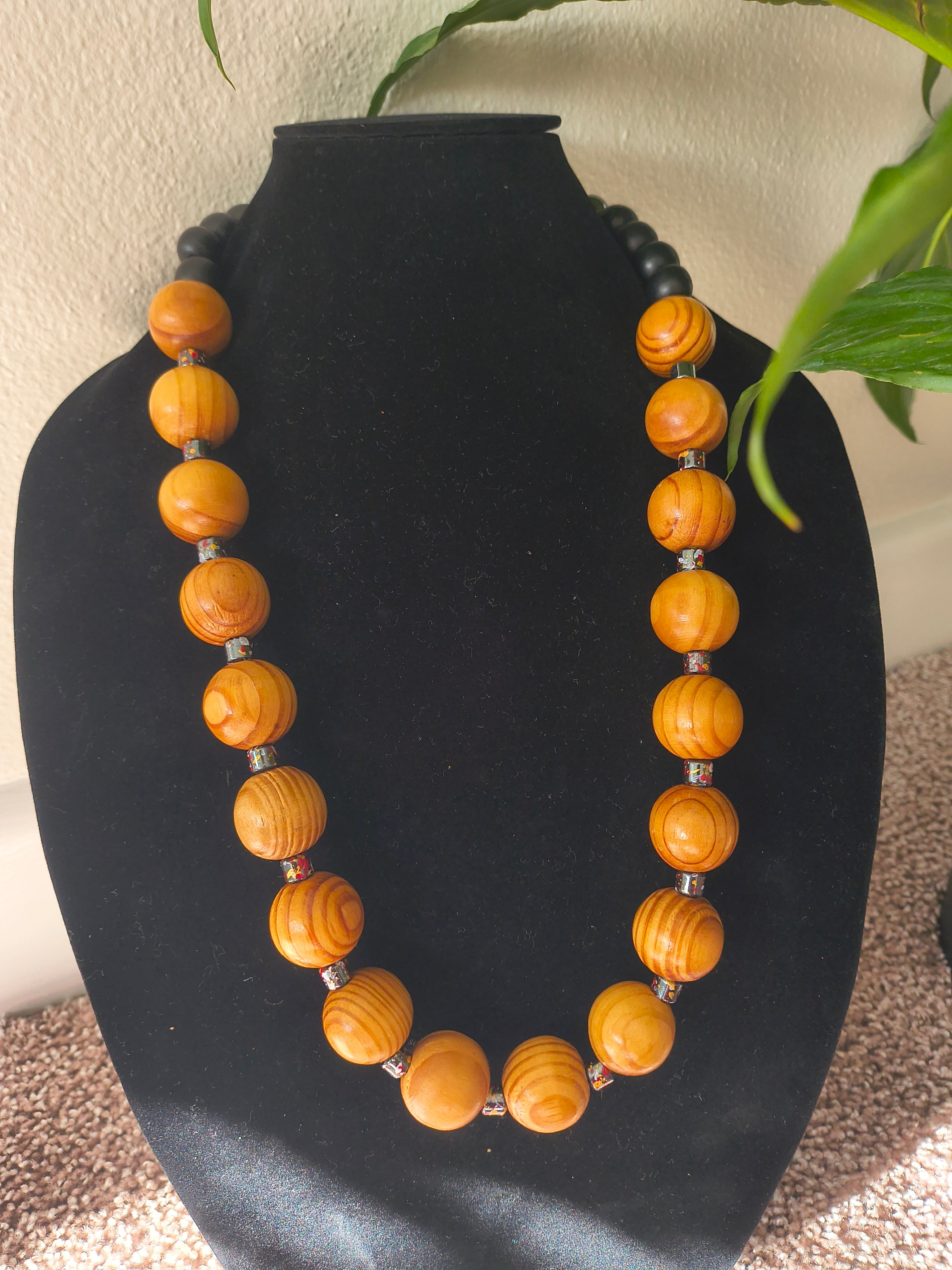 Light brown wood and black wood beads with hematite crystal bead necklace
